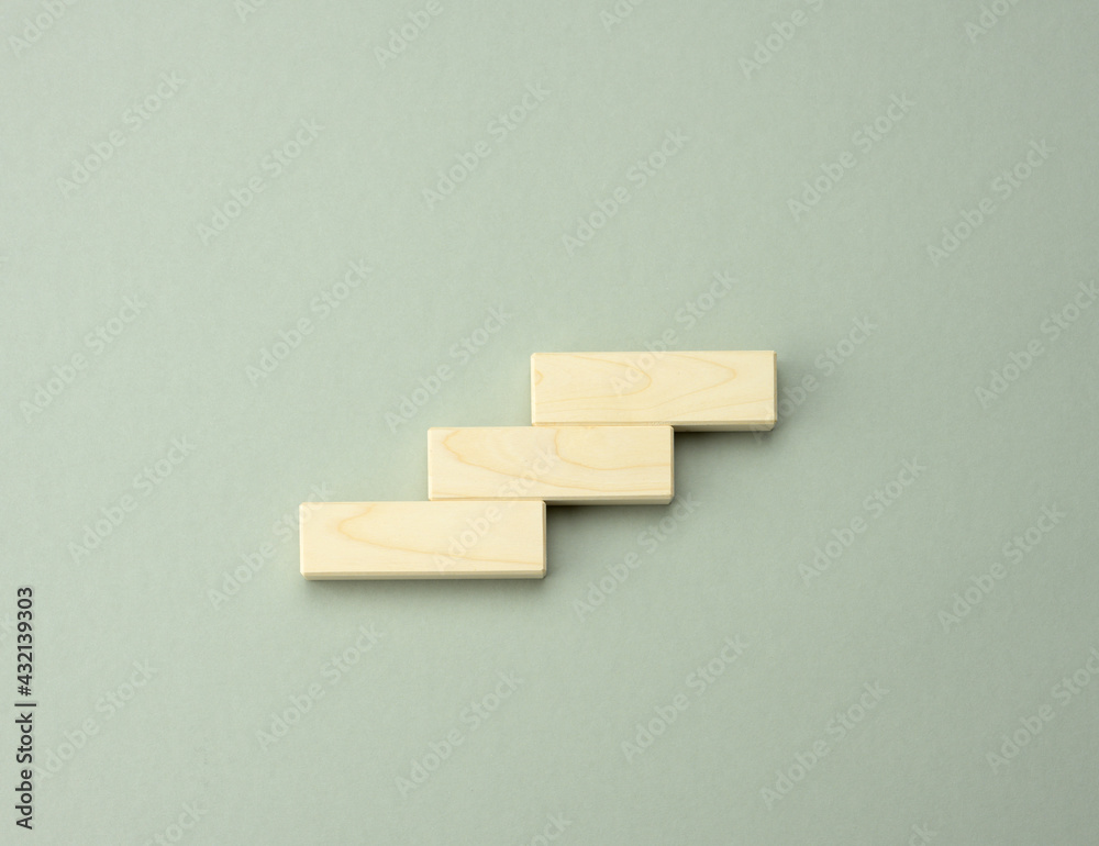 three wooden cubes in the form of steps up three wooden cubes in the form of steps up