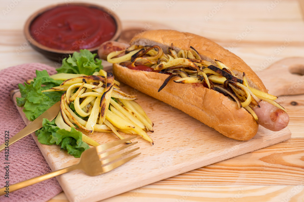 Freshly grilled hot dog with mustard and french fries in a serving basket Freshly grilled hot dog with mustard and french fries in a serving basket