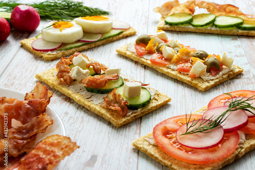 Healthy food products on dietetic breads in a close-up front view