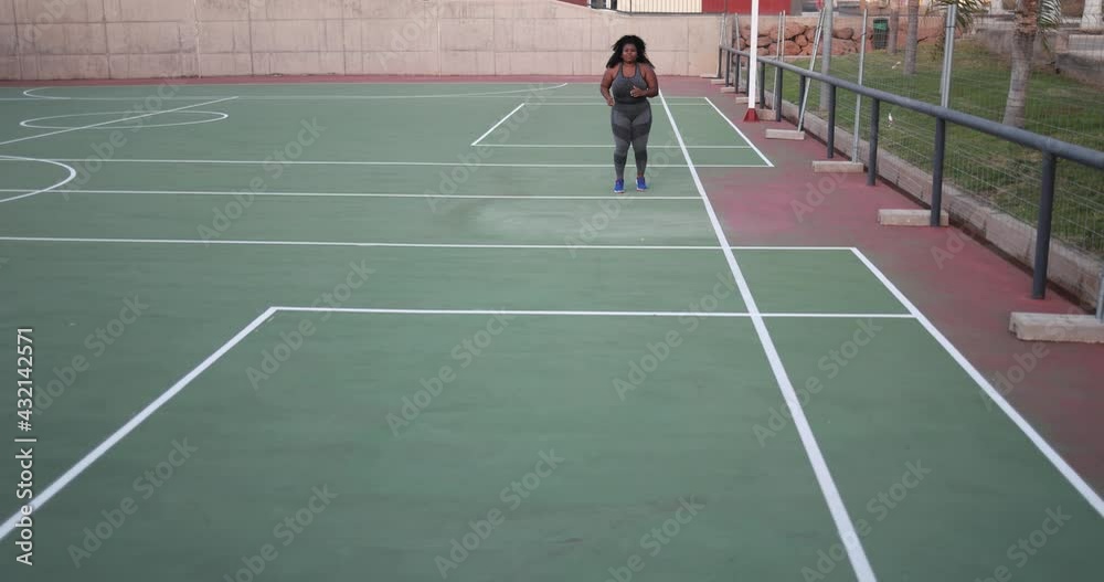Curvy woman running outdoor - Plus size body, sport and healthy lifestyle concept Curvy woman running outdoor - Plus size body, sport and healthy lifestyle concept