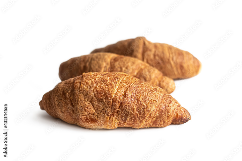 Several croissants made of puff pastry with a golden crust, on a white background Several croissants made of puff pastry with a golden crust, on a white background