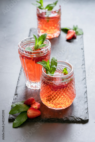 Refreshing summer drink with strawberry and mint