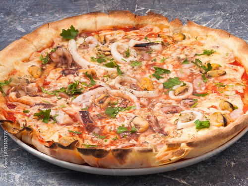 pizza with seafood: shrimp, squid, mussels, octopus