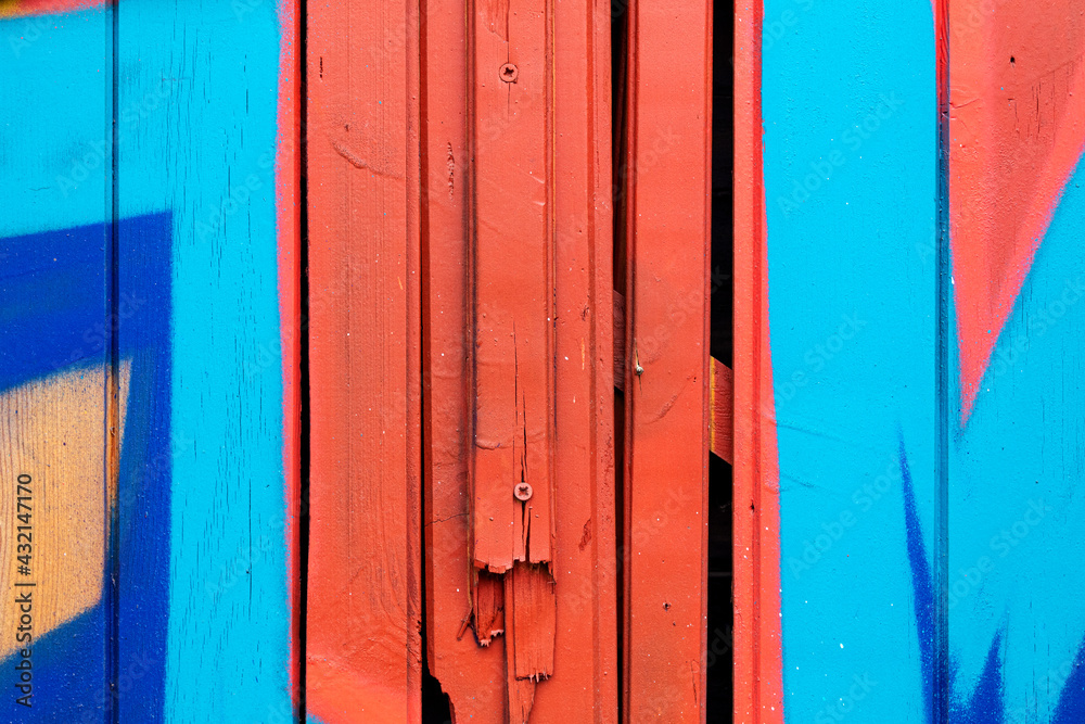 Wooden fence, background with wood planks painted with paint in close-up