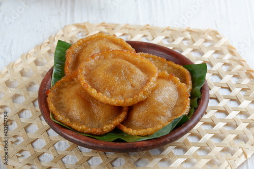 Kue Kucur or Kucur or kuih cucur, and called khanom fak bua or khanom jujun in Thai, is a traditional snack in Southeast Asia, including Indonesia, Malaysia and Southern Thailand. photo