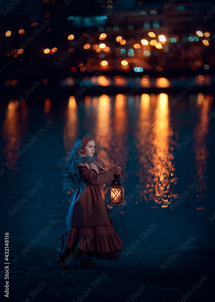 A girl with lantern on the shore of a pond at night