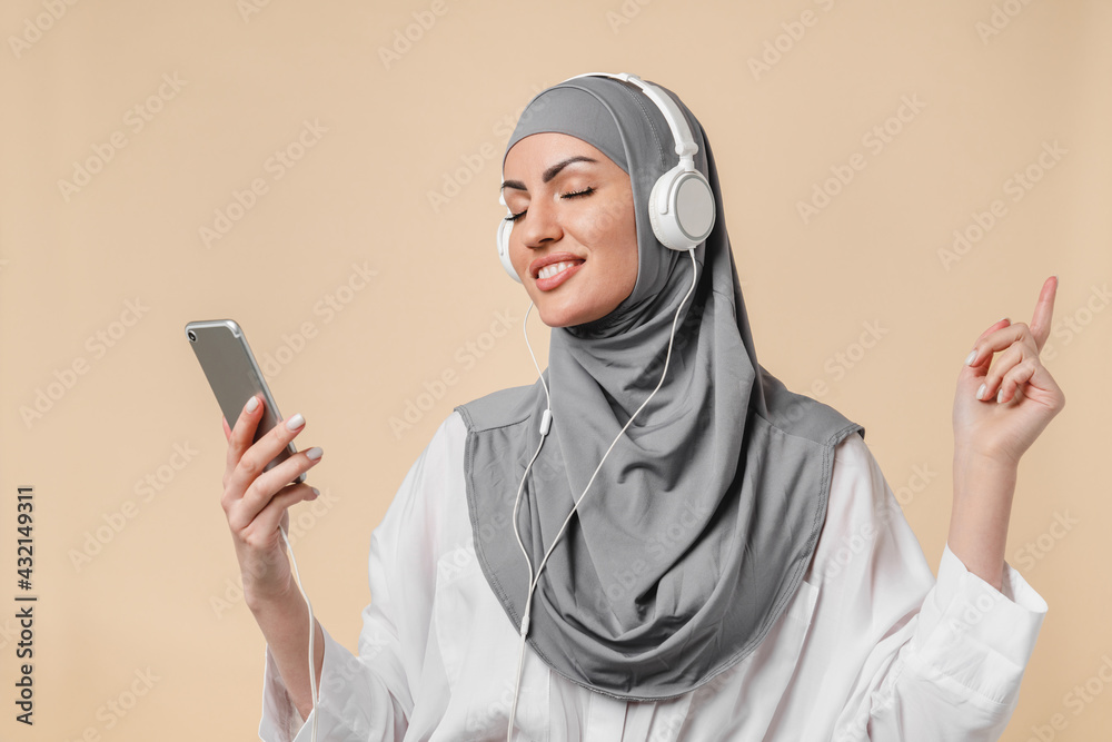 Dancing happy young muslim middle eastern islamic arabian woman student ...
