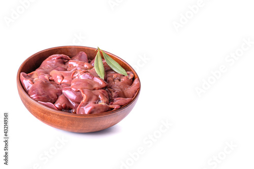 raw chicken or goose liver with bay leaf in a clay bowl close-up, isolated on a white background