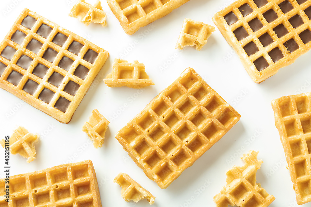 Yellow waffles on a white background top view, pattern Yellow waffles on a white background top view, pattern