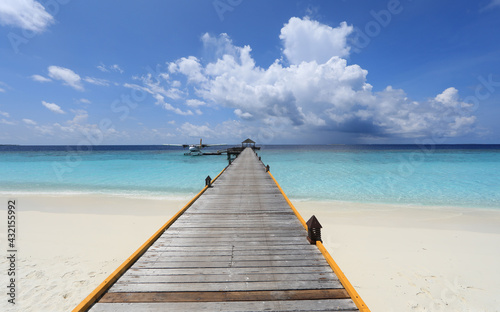 wooden pier at tropical island resort in Maldives © serikbaib