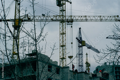 construction site workers, house construction, tower cranes