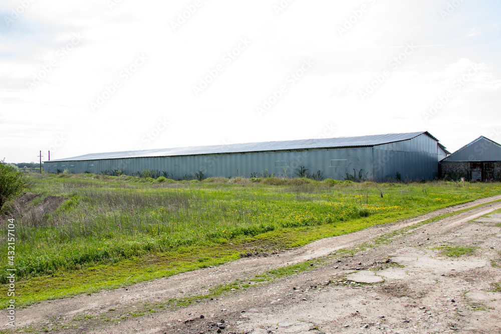 New buildings and old buildings grain storage hangars in the countryside of Ukraine