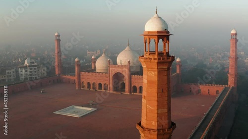 Badshahi Mosque In Lahore, Punjab, Pakistan On A Foggy Sunrise. aerial drone photo
