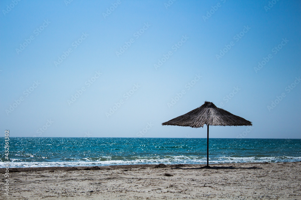 Sea summer beach panorama view with wooden umbrella Black sea Sea summer beach panorama view with wooden umbrella Black sea