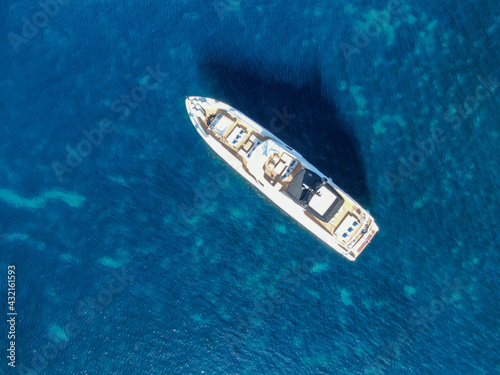 yacht sailing in the blue sea. Concept of holidays, luxury a relax  © Enrique