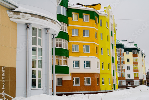 street with colored houses in snow in Beloyarsky, Khanty-Mansi Autonomous Okrug, Russia
