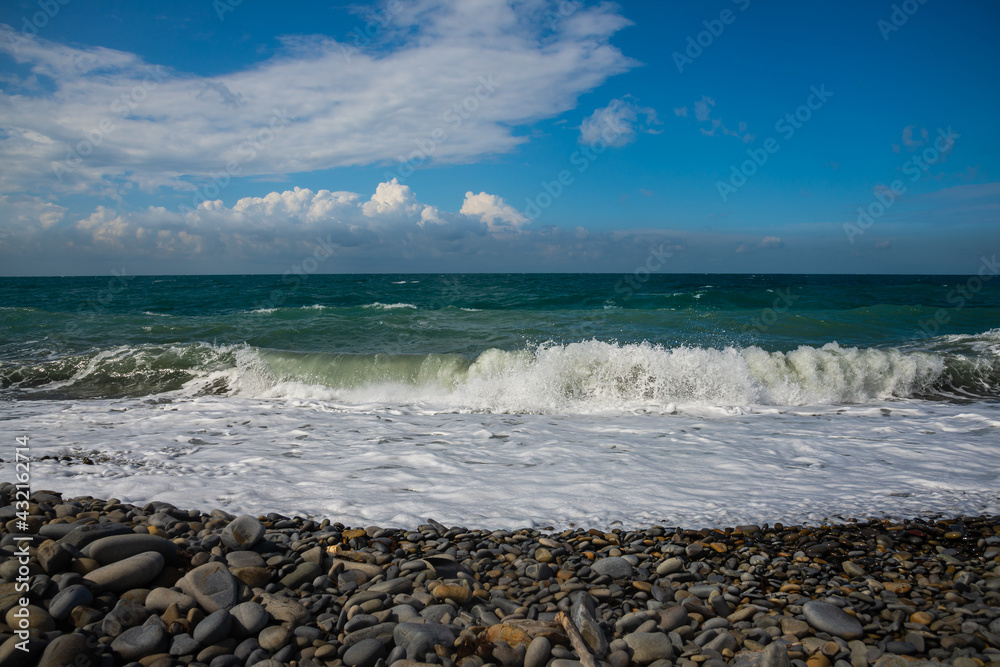 Deep sea water waves. Pebble beach on the Black Sea coast Deep sea water waves. Pebble beach on the Black Sea coast