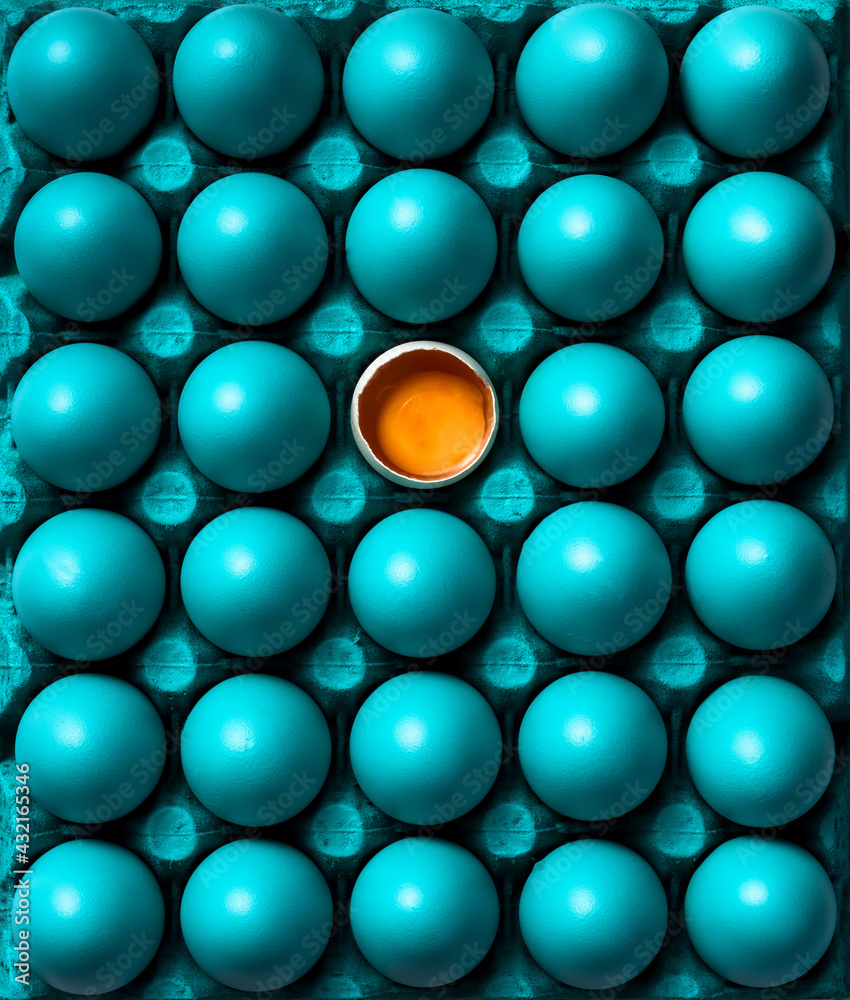 Open Egg with Yolk Stand Out from Pastel Blue Eggs Crowd. Flat Lay Top Down Abstract Patter food Image