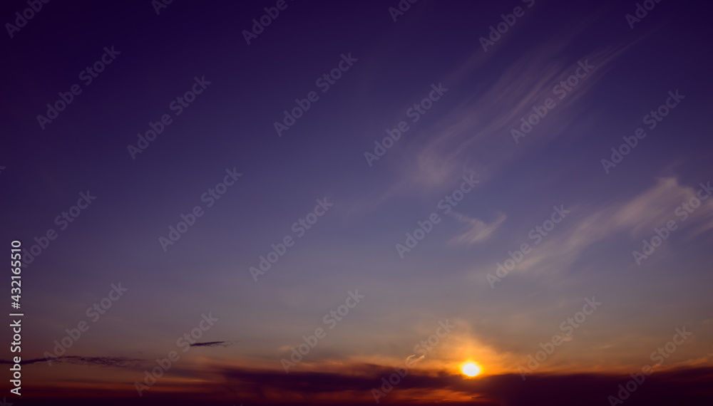 Beautiful colorful sunset sky with clouds and sunlight.