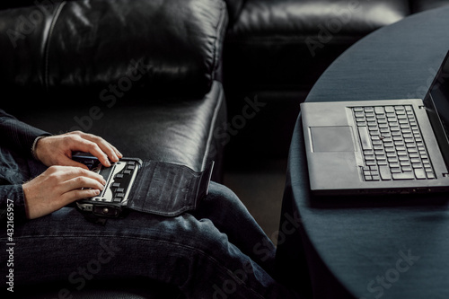 Man using Braille keyboard photo