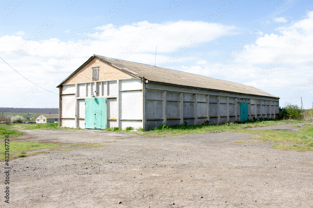 New buildings and old buildings grain storage hangars in the countryside of Ukraine