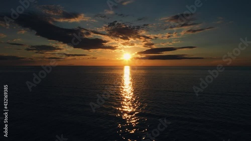 Aerial drone view over the reflecting ocean calm midnight sun sky in Scandinavia photo