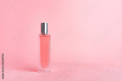 Perfume bottles on a pink background . Aromatherapy. The scent of perfume. The choice of fragrance. Pink background.