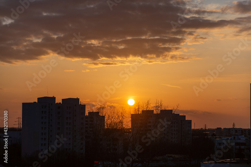 sunset over apartment blocks in the city