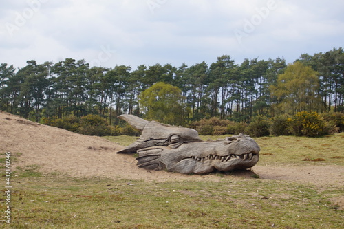 Dragon face wooden sculpture in West Stow Country Park