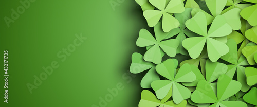 Tablou canvas Cloverleaf background isolated on a green background to the left