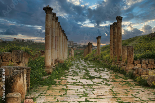 The colonnade of the decumanus maximus in the ancient Roman city of Jerash photo
