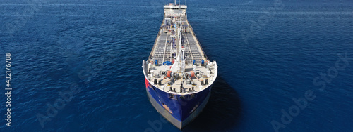 Aerial drone ultra wide panoramic photo of crude oil tanker carrier anchored in deep blue open ocean sea © aerial-drone