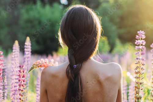 woman in the field of flowers