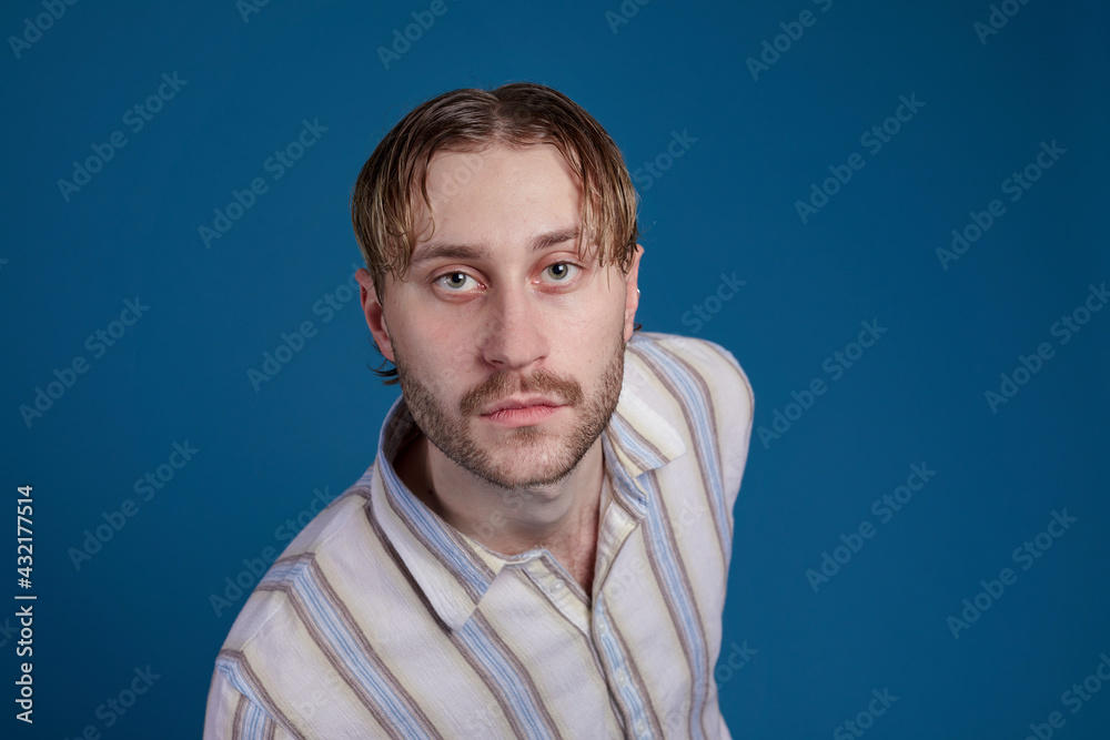 Man looking at camera, studio shot Man looking at camera, studio shot