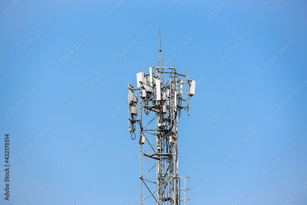 Telecommunication tower of 4G and 5G cellular for support IOT.  Wireless connection system equipment with radio modules and antenna with clear sky background.