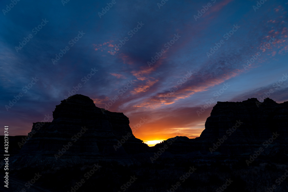 Western sunrise silhouette with desert mountains