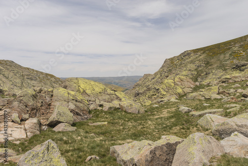 Beautiful view of the Sierra de Gredos Regional park  with stones and grass in Gredos Spain photo