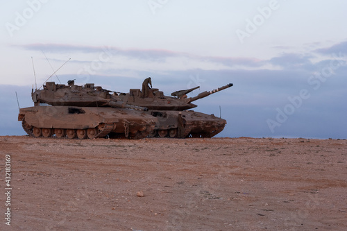 Tanks Merkava 4 in the Negev desert. Morning dawn. Sunrise.