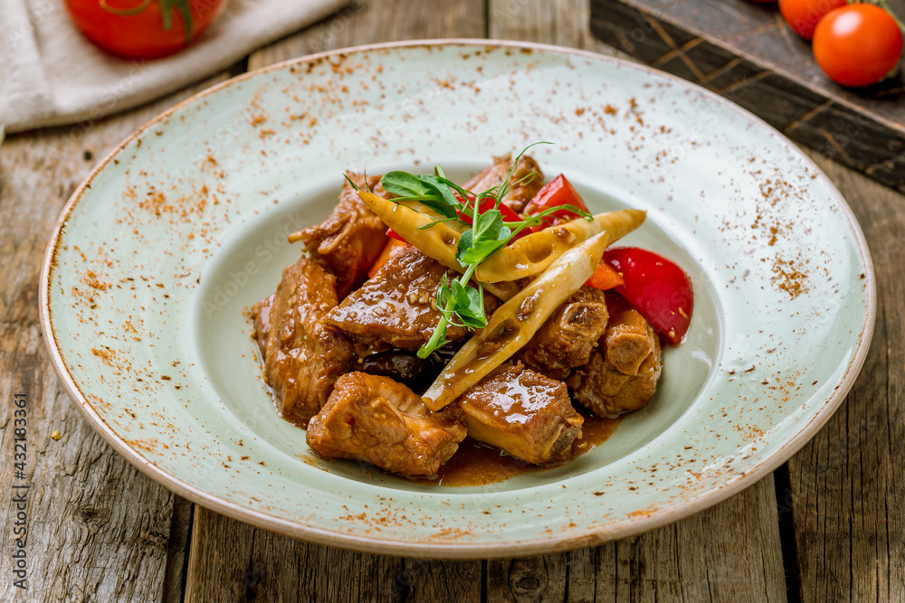 pork ribs with soy sause in Chinese on wooden background pork ribs with soy sause in Chinese on wooden background