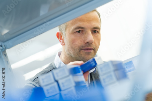 Wallpaper Mural tidying goods in cardboard box in a warehouse Torontodigital.ca