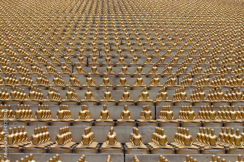 Million golden Buddha figurine in Wat Phra Dhammakaya. Buddhist temple, Bangkok, Thailand photo