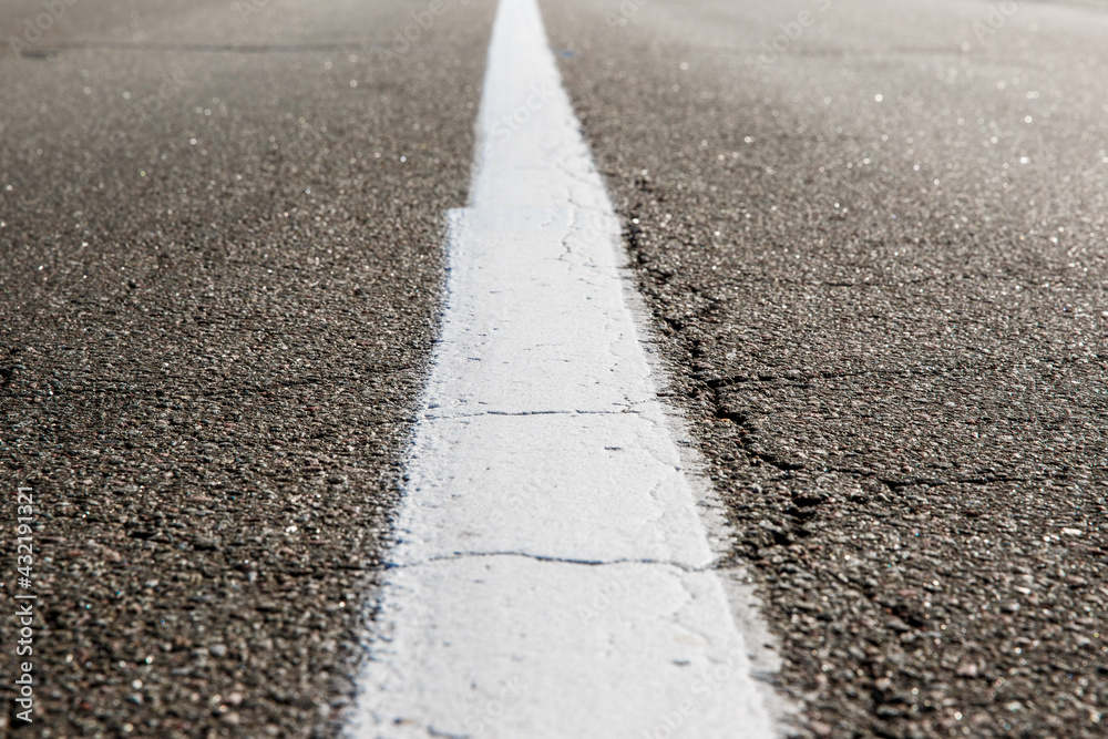 Old asphalt road. Driving on an empty road Old asphalt road. Driving on an empty road