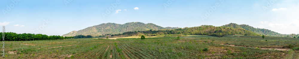 Beautiful views of hills and farming in the Thai countryside on clear day.