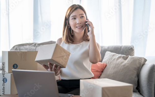 Young Asian woman, SME business owner, Receive orders from customers, Product delivery service, Work from home.