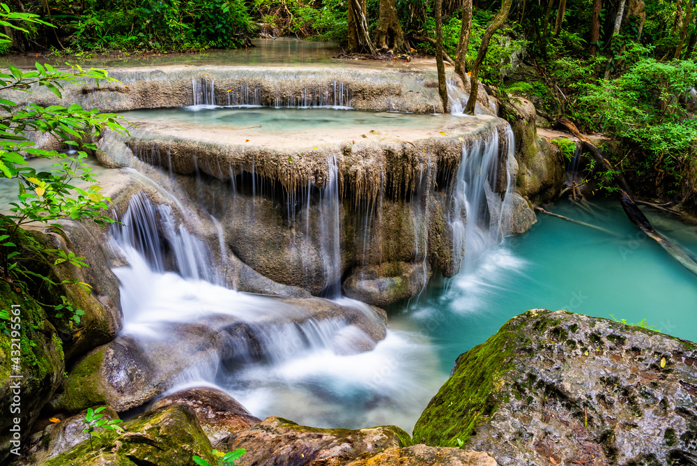 Waterfall and blue emerald water color in Erawan national park. Erawan Waterfall, Beautiful nature rock waterfall steps in tropical rainforest at Kanchanaburi province, Thailand