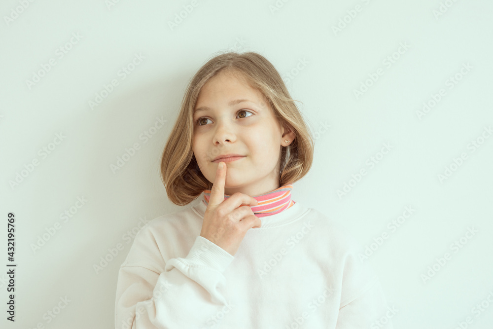 Dreamy preteen girl with beautiful eyes on white background Dreamy preteen girl with beautiful eyes on white background