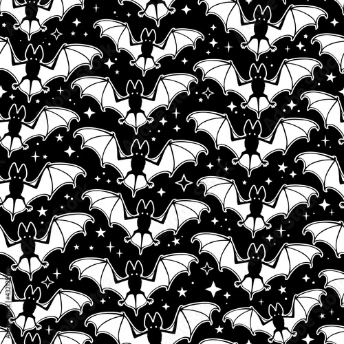 seamless pattern of white soaring bats on a black background