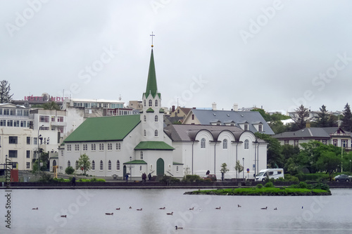 The Free Church in Reykjavik and ducks on lake Tjornin, Iceland, Europe photo