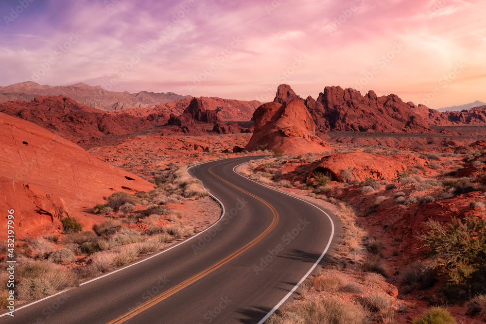 Valley of Fire State Park, Nevada, United States. Scenic road in the desert during a cloudy morning. Dramatic Sunrise Sky Art Render.