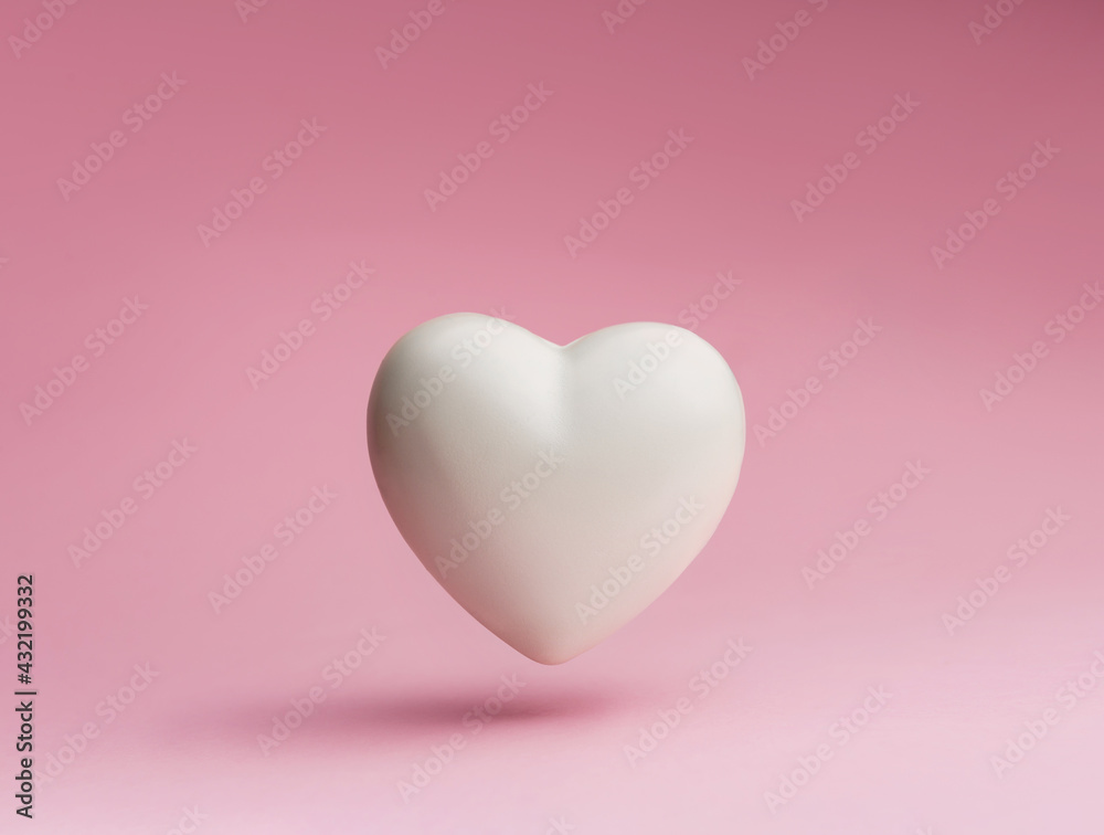 White heart symbol on a pastel pink background.